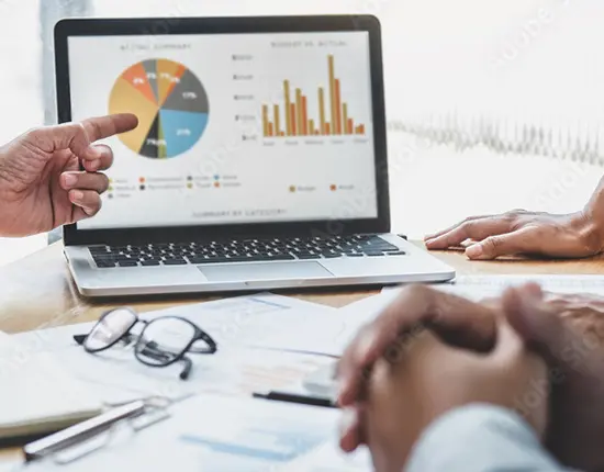 Marketing operations team reviewing campaign performance dashboard during a resource gap meeting