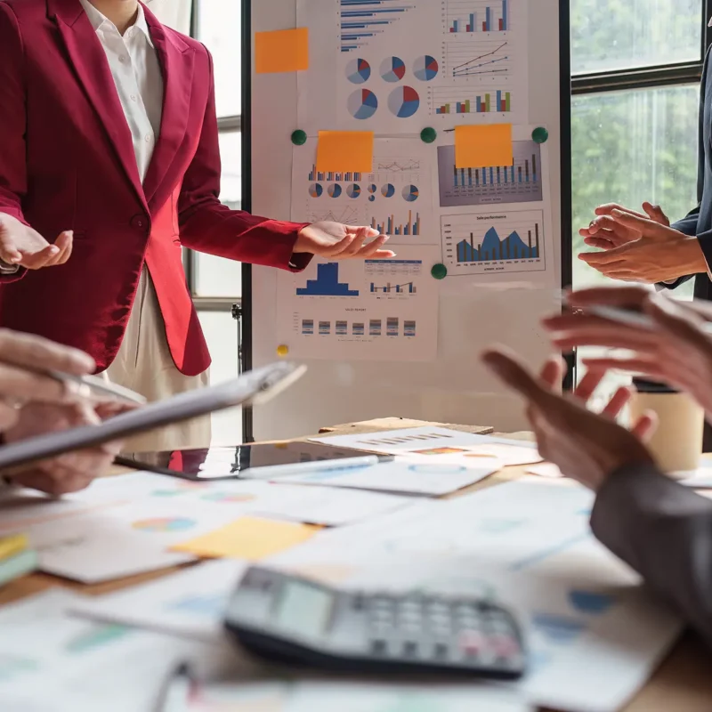 Marketing Reporting Assessment for B2B marketing teams discussing inconsistent reporting dashboards in a strategy meeting