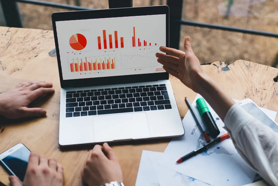 Team reviewing lifecycle and campaign workflow planning on a laptop