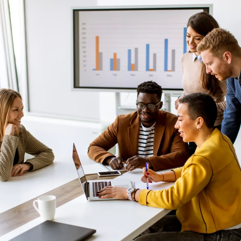 Team reviewing marketing performance insights to support Marketo Measure attribution and reporting