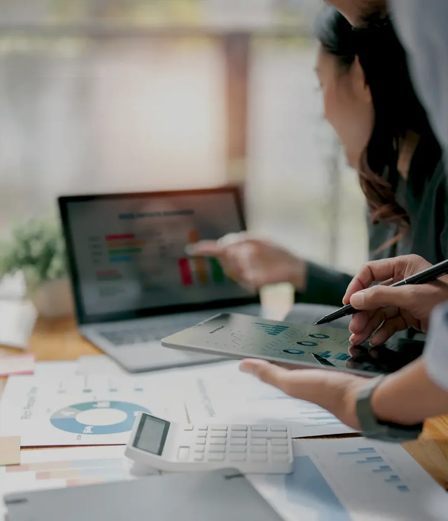 Team reviewing Funnel.io reporting and marketing performance analysis on a tablet