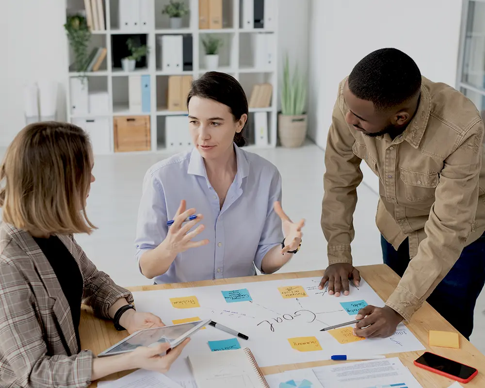 B2B marketing team collaborating on workflow planning for Knak consulting